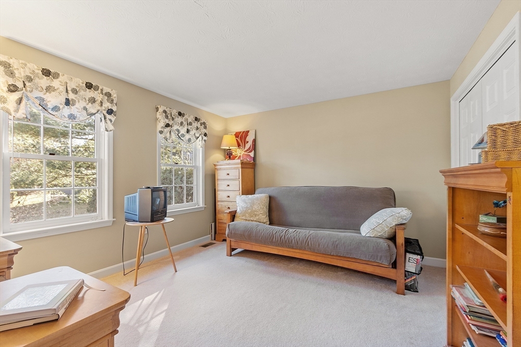 92 Stonegate Road, Unit 92 Chelmsford, MA 01824 - Photo 20 of 32 a living room with furniture and a window