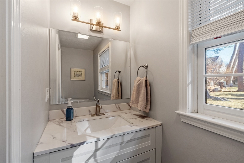 92 Stonegate Road, Unit 92 Chelmsford, MA 01824 - Photo 21 of 32 a bathroom with a sink vanity and a mirror