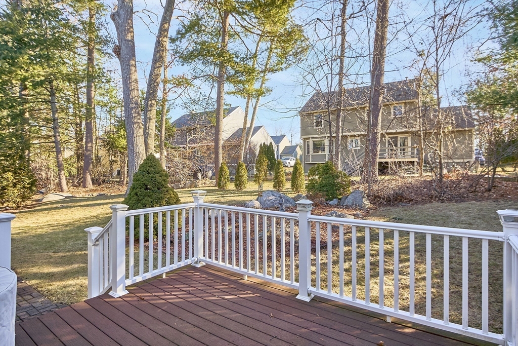92 Stonegate Road, Unit 92 Chelmsford, MA 01824 - Photo 26 of 32 a view of a wooden roof deck