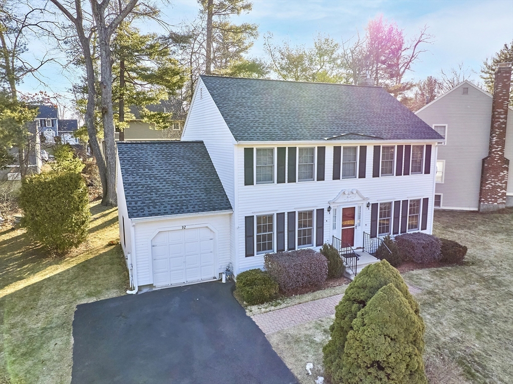 92 Stonegate Road, Unit 92 Chelmsford, MA 01824 - Photo 29 of 32 a front view of a house with a yard