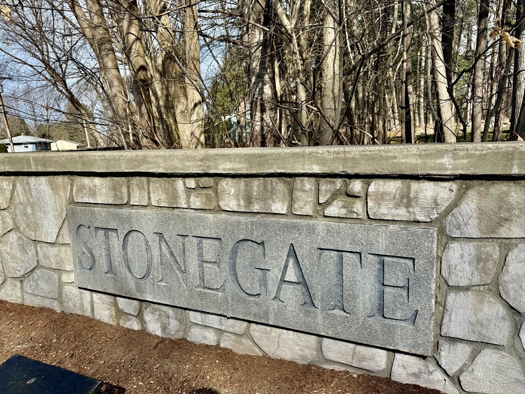 92 Stonegate Road, Unit 92 Chelmsford, MA 01824 - Photo 32 of 32 a close up of a street sign