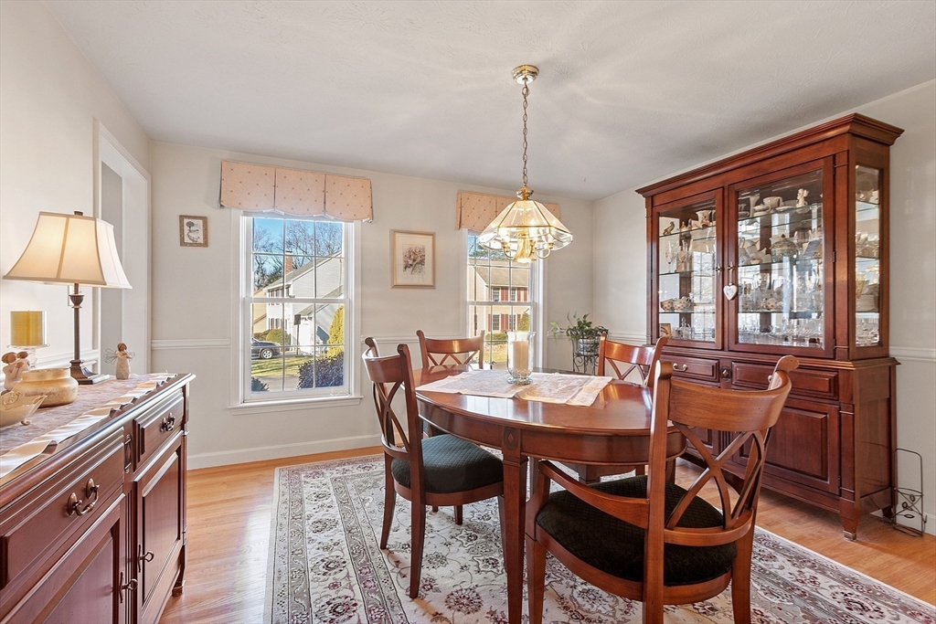 92 Stonegate Road, Unit 92 Chelmsford, MA 01824 - Photo 8 of 32 a view of a dining room with furniture window and outside view
