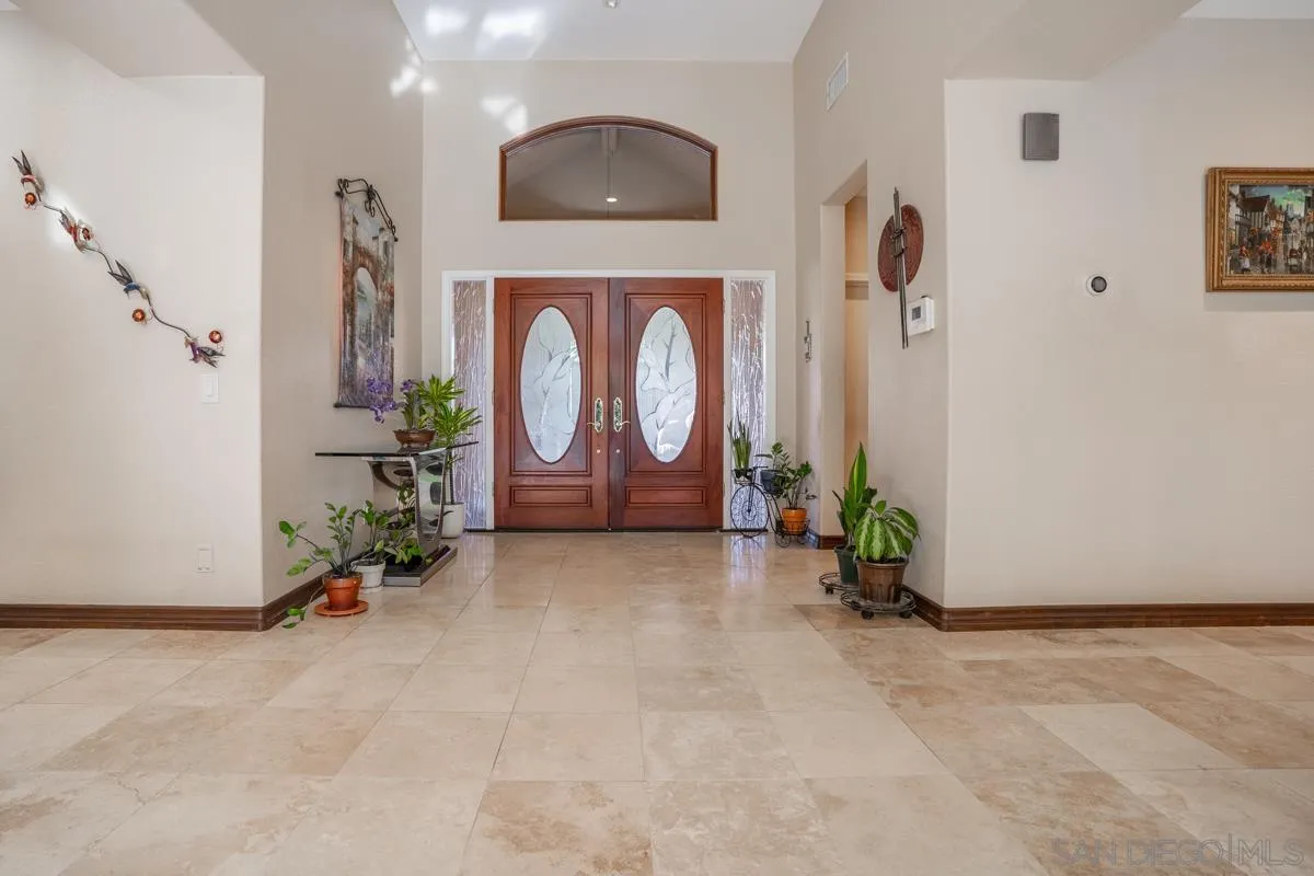 16072 Cross Fox Court Poway, CA 92064 - Photo 13 of 70 a room with painting on the wall and a potted plant