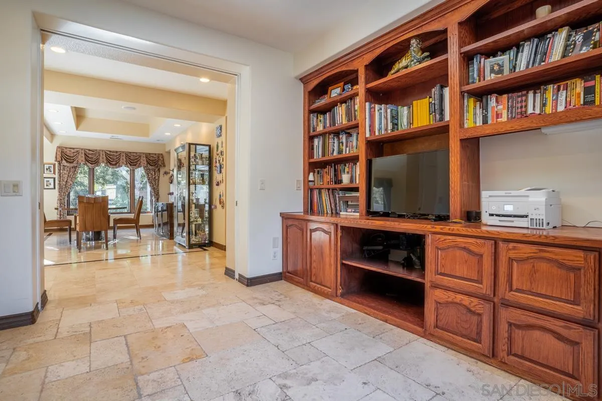 16072 Cross Fox Court Poway, CA 92064 - Photo 14 of 70 a living room with furniture a bookshelf and a window