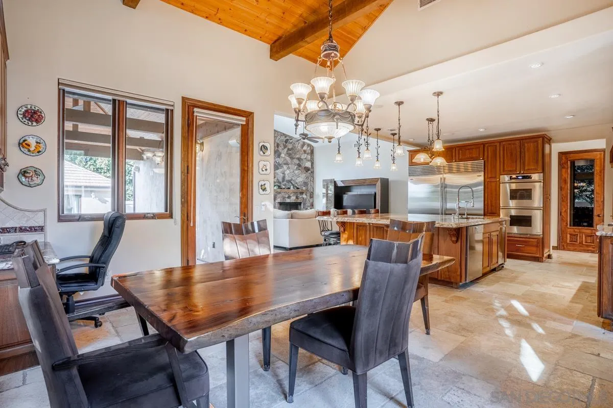 16072 Cross Fox Court Poway, CA 92064 - Photo 21 of 70 a dining room with furniture a chandelier and wooden floor