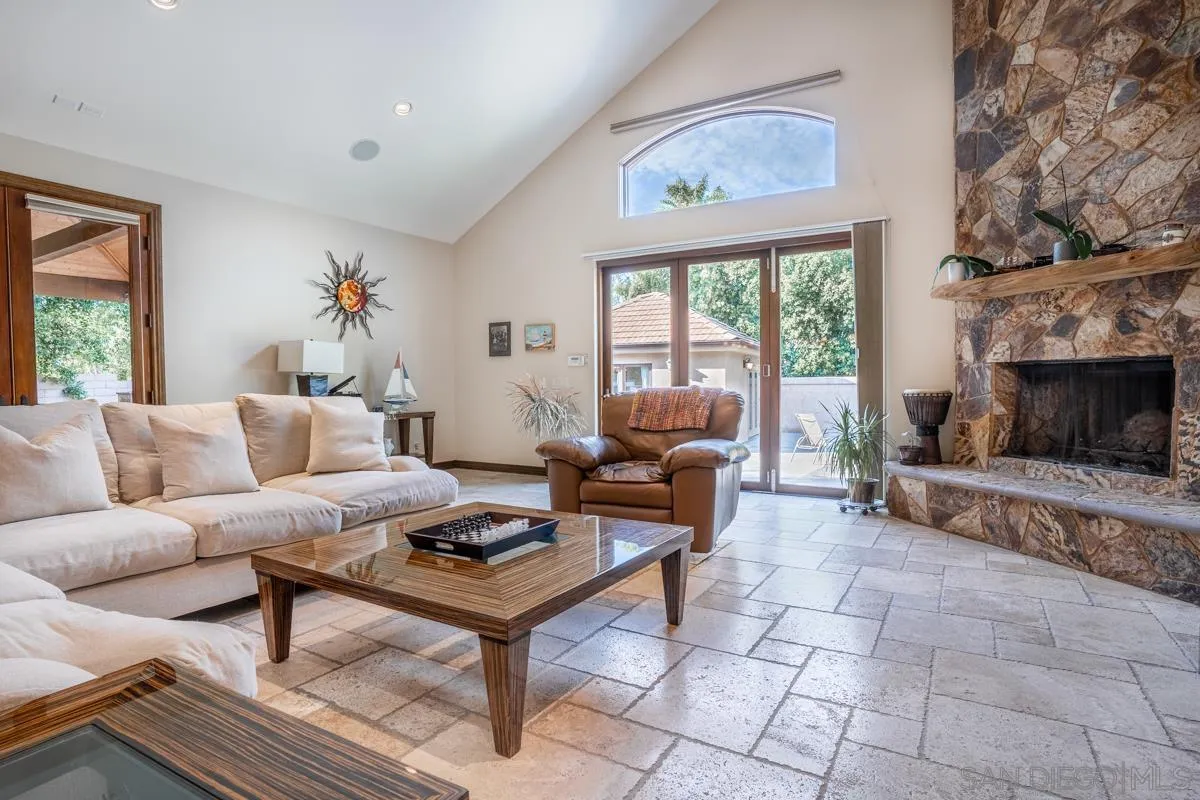 16072 Cross Fox Court Poway, CA 92064 - Photo 28 of 70 a living room with furniture a fireplace and a large window