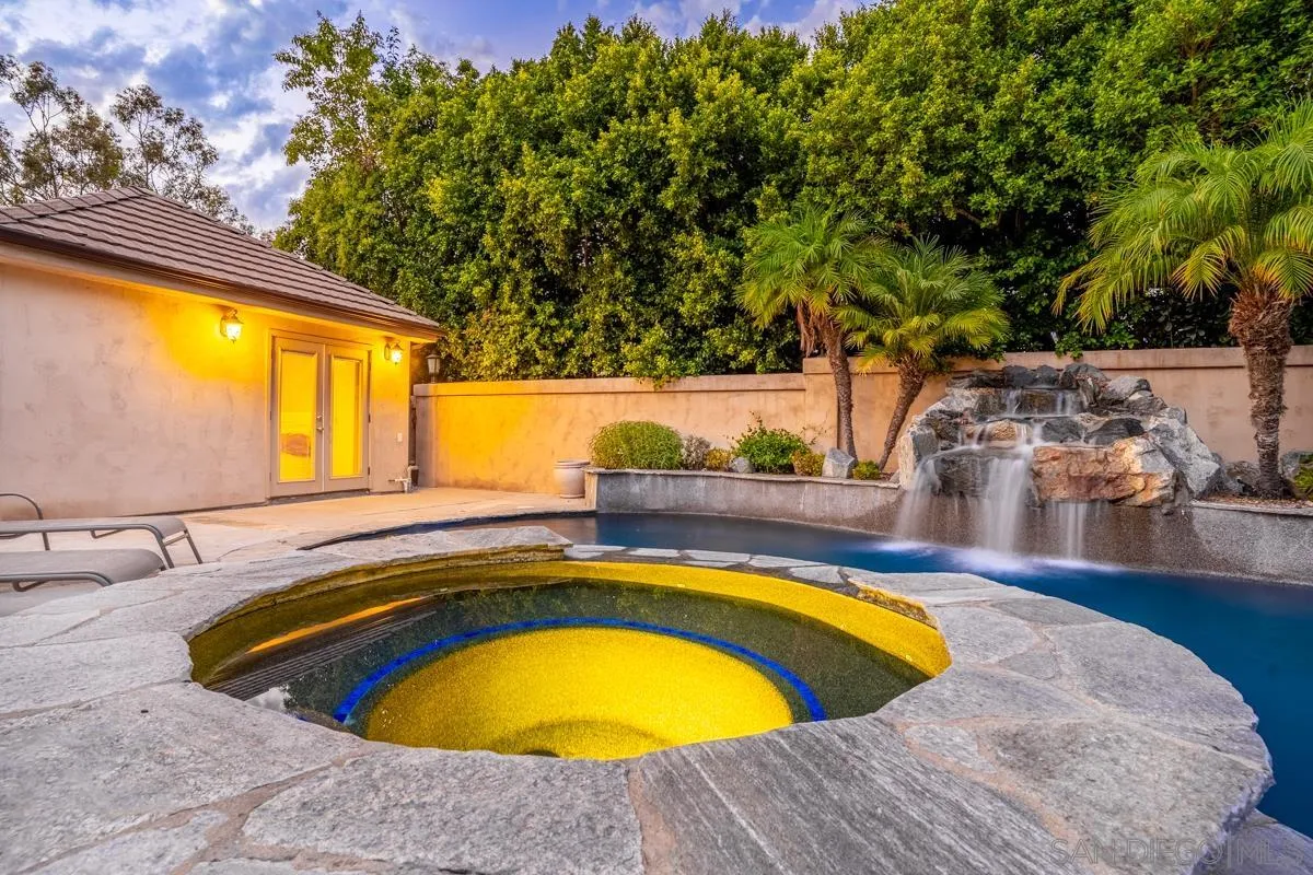 16072 Cross Fox Court Poway, CA 92064 - Photo 35 of 70 a view of a swimming pool with a yard and seating area