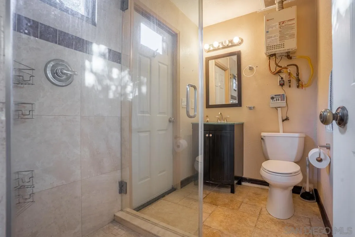 16072 Cross Fox Court Poway, CA 92064 - Photo 44 of 70 a bathroom with a toilet sink and shower