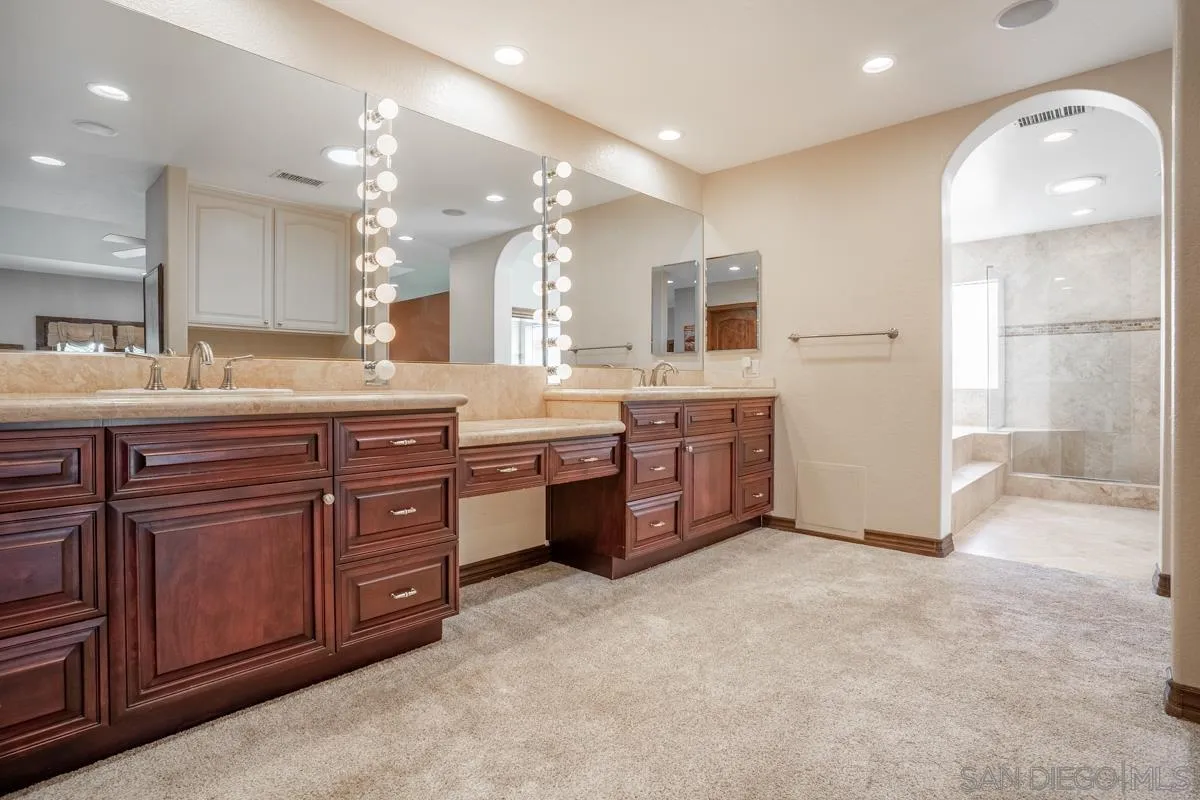 16072 Cross Fox Court Poway, CA 92064 - Photo 50 of 70 a large bathroom with a large tub and sink