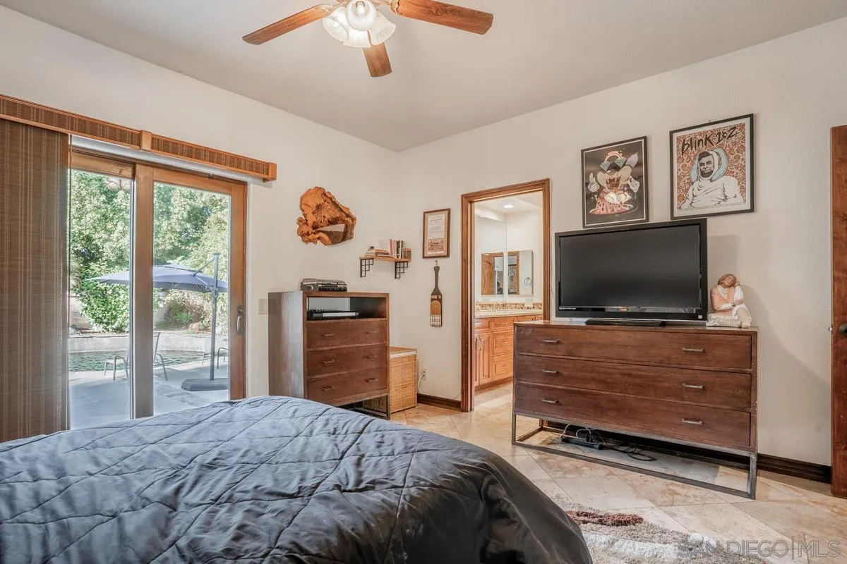 16072 Cross Fox Court Poway, CA 92064 - Photo 54 of 70 a bedroom with a bed and a flat screen tv