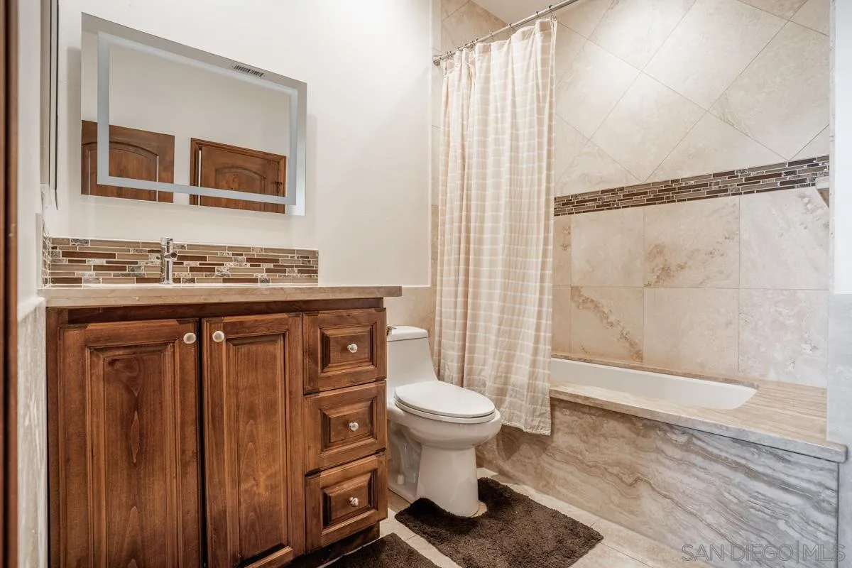 16072 Cross Fox Court Poway, CA 92064 - Photo 58 of 70 a bathroom with a sink toilet and shower