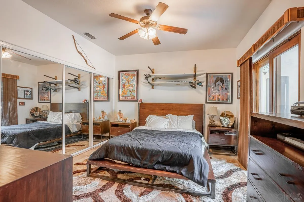 16072 Cross Fox Court Poway, CA 92064 - Photo 61 of 70 a bedroom with a bed and a large mirror on the dresser