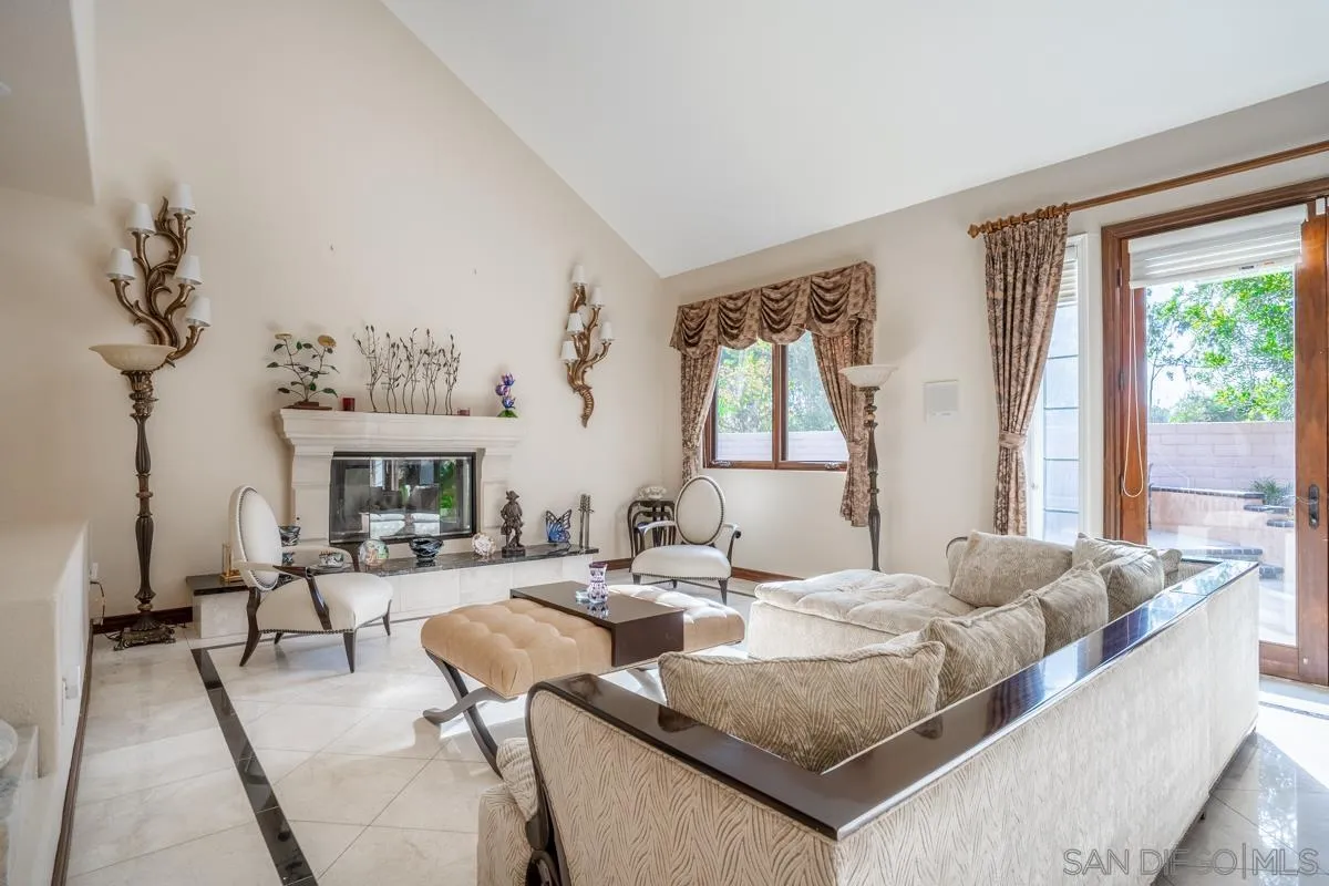 16072 Cross Fox Court Poway, CA 92064 - Photo 8 of 70 a living room with fireplace furniture and a large window