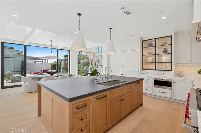 a kitchen with kitchen island a sink stove and center island