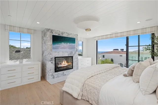 a bedroom with a bed and a fireplace