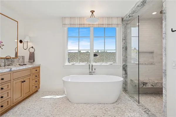 a bathroom with a bathtub and a sink