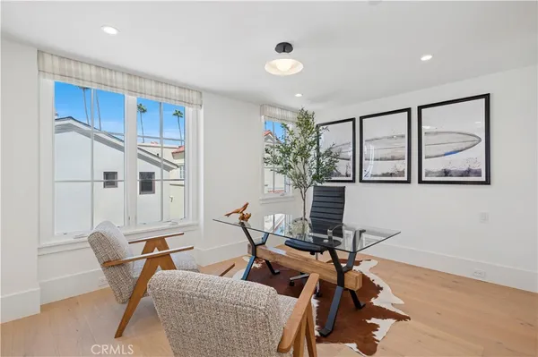 a view of a livingroom with furniture and a workspace