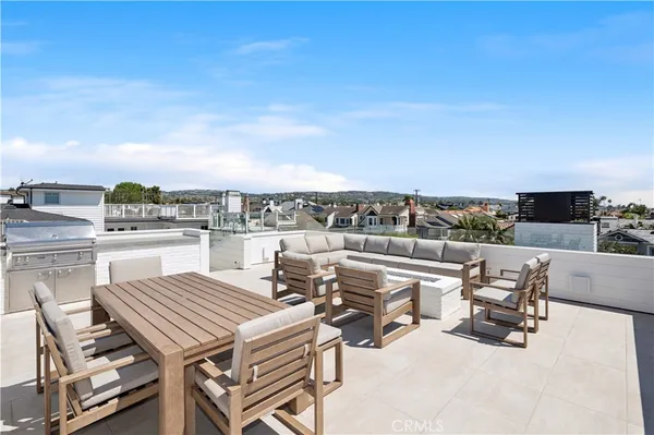 a view of a terrace with furniture and stove