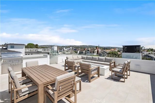 a view of a terrace with furniture and stove
