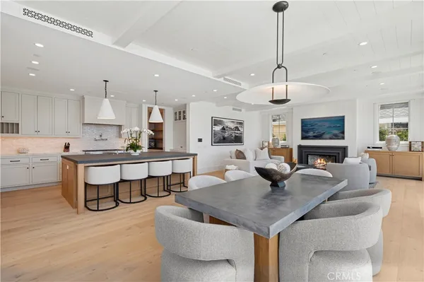 a large kitchen with a table and chairs