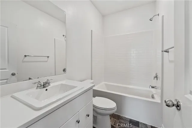 a bedroom with a bed and a table