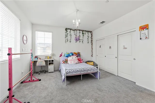 a bathroom with a double vanity sink mirror and shower
