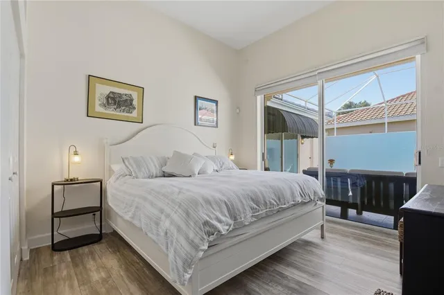 a bedroom with a bed and a lamp