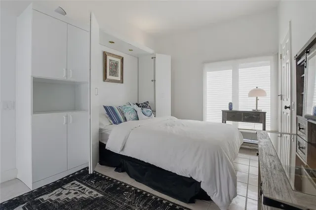 a view of an outdoor dining space with a table and chairs