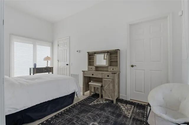 a view of a garden with plants and large trees