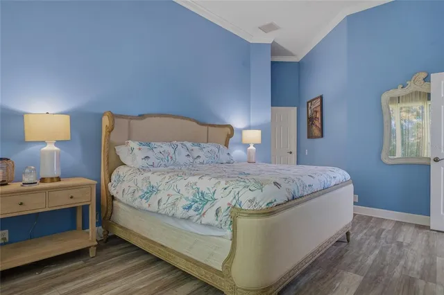 an aerial view of a house with a garden and swimming pool