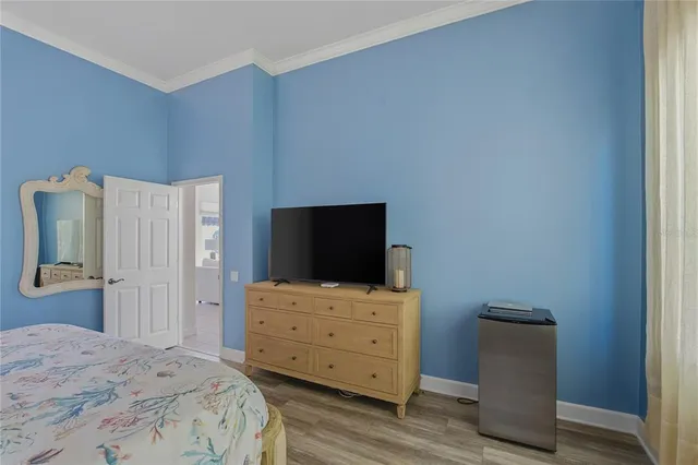 a view of a patio with chairs and table under an umbrella