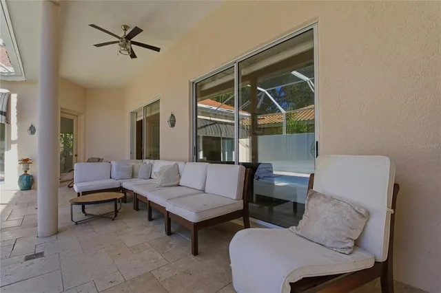 a bathroom with a granite countertop sink a toilet and a shower