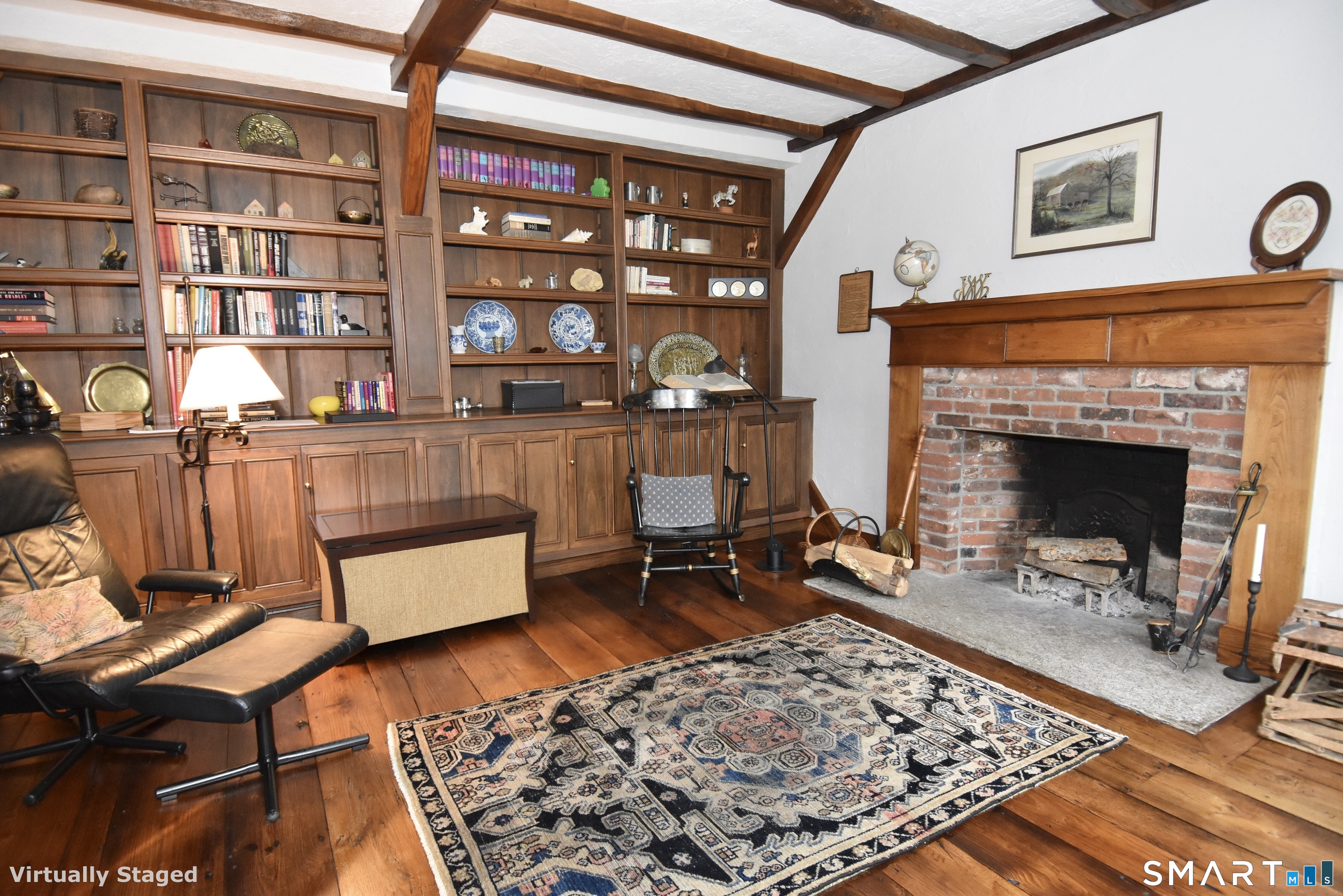 148 Flanders Road Woodbury, CT 06798 - Photo 4 of 16 Library with Fireplace and Built-in Bookshelves