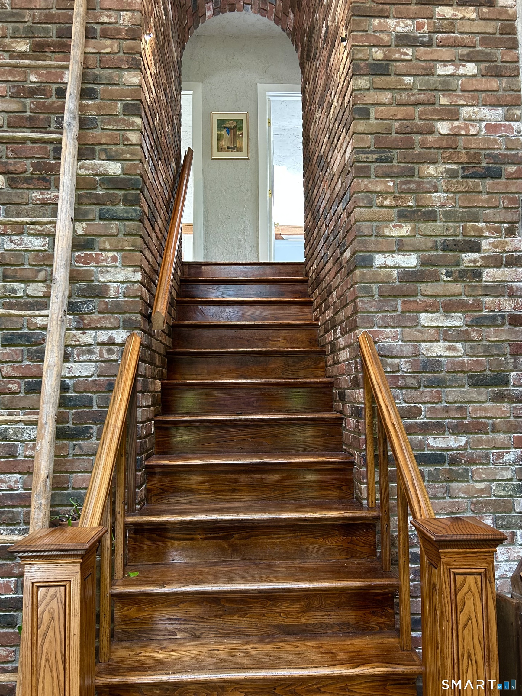 148 Flanders Road Woodbury, CT 06798 - Photo 5 of 16 Brick Archway to Second Floor