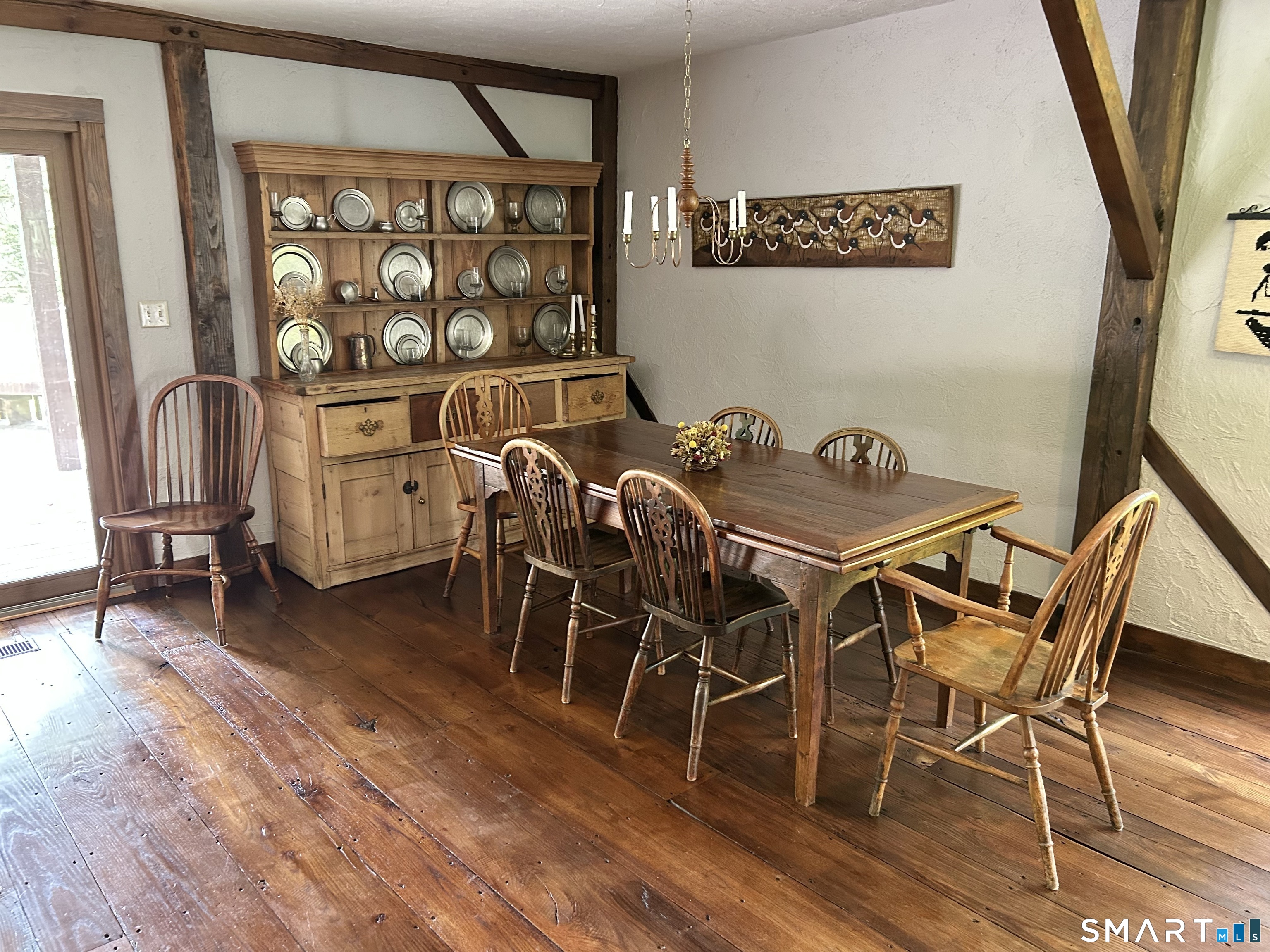 148 Flanders Road Woodbury, CT 06798 - Photo 7 of 16 a view of a dining room with furniture and a window