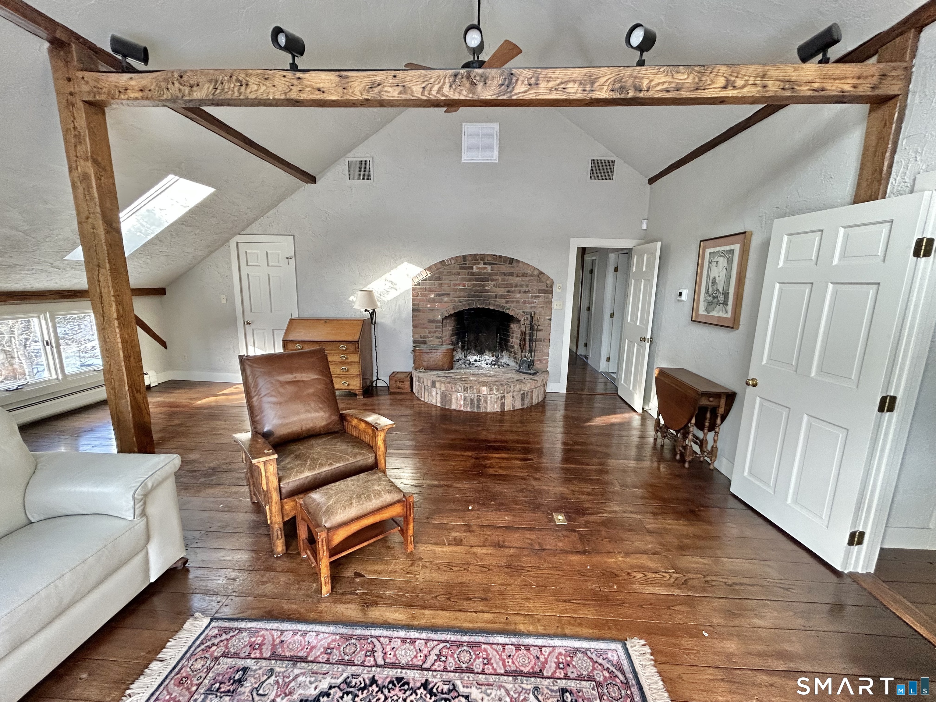 148 Flanders Road Woodbury, CT 06798 - Photo 7 of 16 Primary Bedroom with Fireplace and Sitting Area