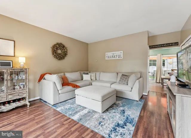 a living room with furniture and a rug