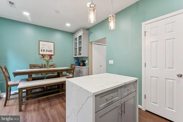 a view of kitchen with furniture and wooden floor