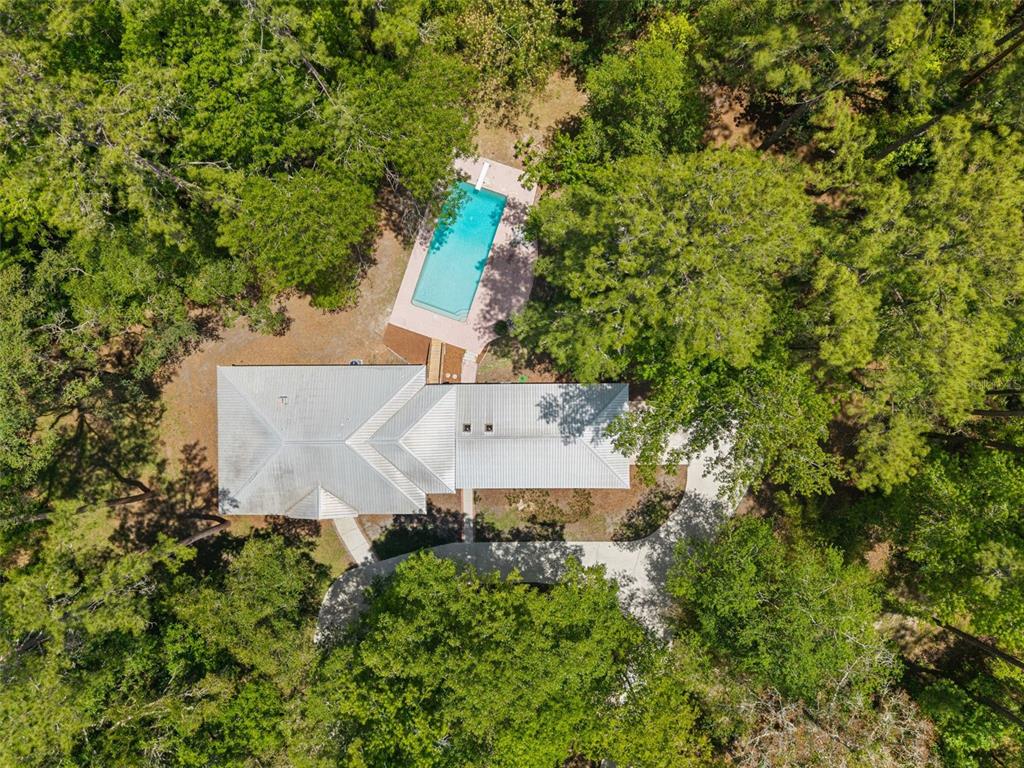 4703 Northwest 124th Street Gainesville, FL 32606 - Photo 51 of 55 an aerial view of a house with yard and outdoor seating