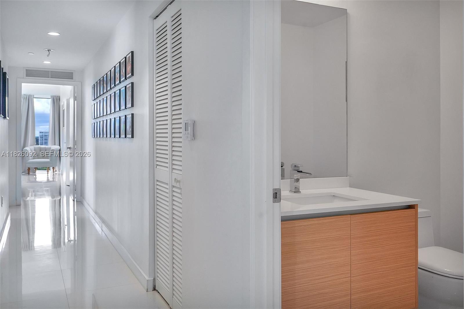 600 Northeast 27th Street, Unit 1105 Miami, FL 33137 - Photo 12 of 100 a bathroom with a sink and a mirror