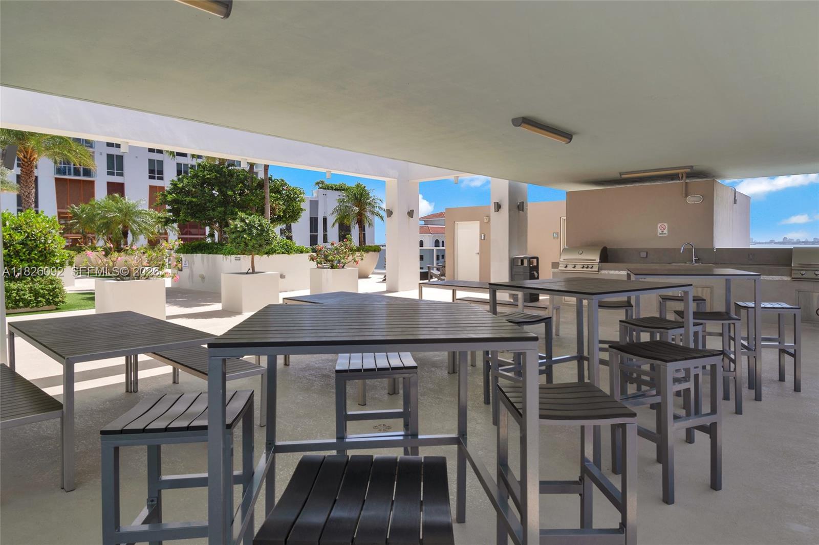 600 Northeast 27th Street, Unit 1105 Miami, FL 33137 - Photo 24 of 100 a view of a dining room kitchen with furniture and wooden floor
