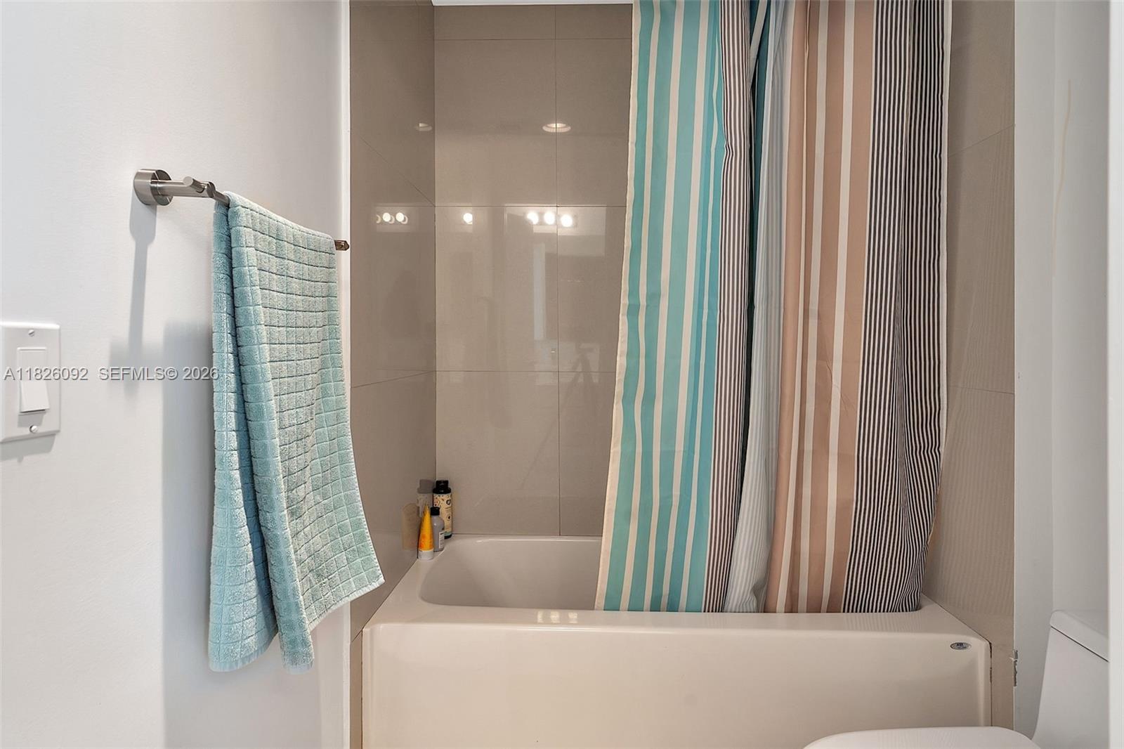 600 Northeast 27th Street, Unit 1105 Miami, FL 33137 - Photo 45 of 100 a bathroom with a bathtub and shower