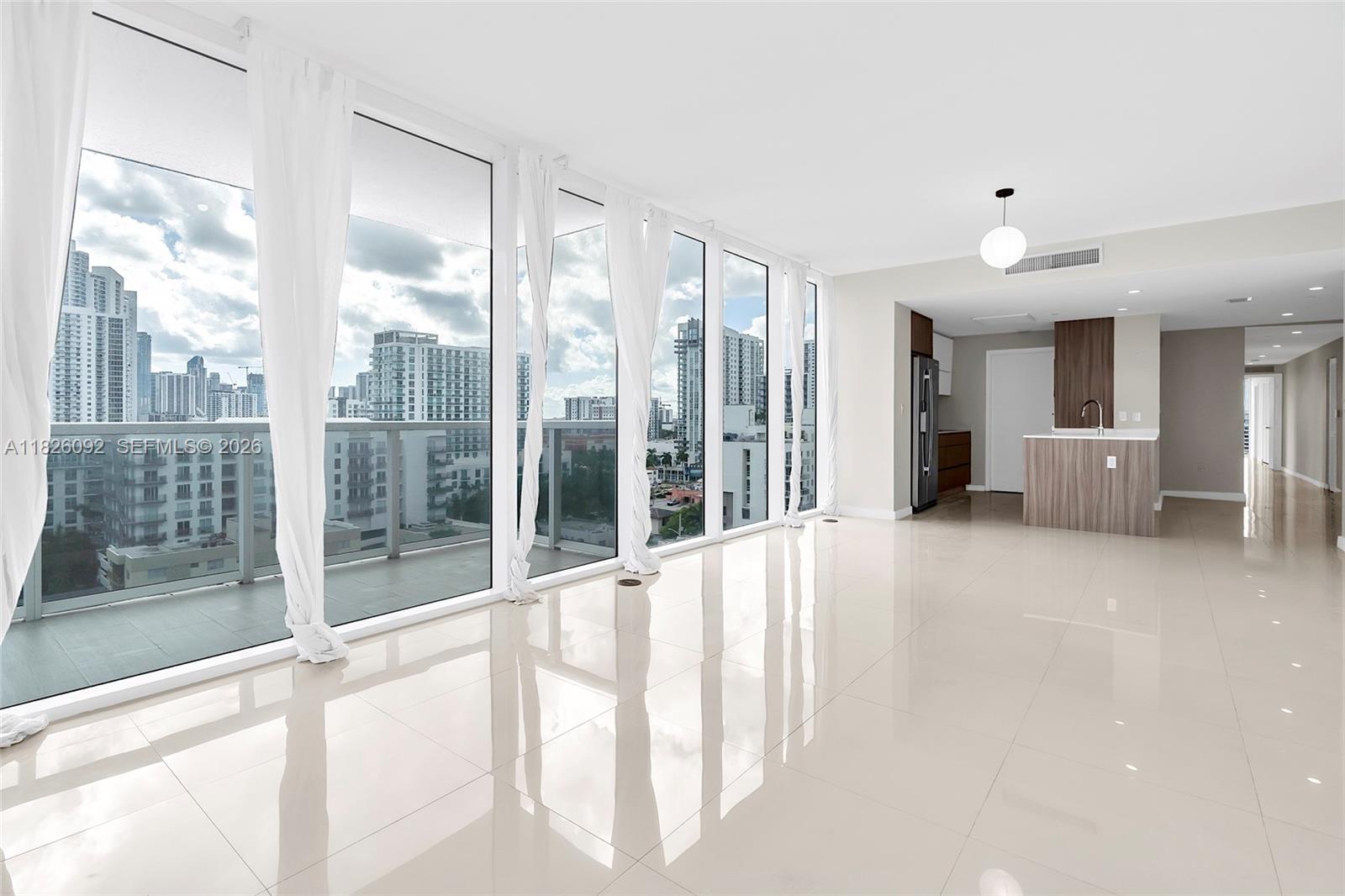 600 Northeast 27th Street, Unit 1105 Miami, FL 33137 - Photo 65 of 100 a view of a big room with balcony and furniture