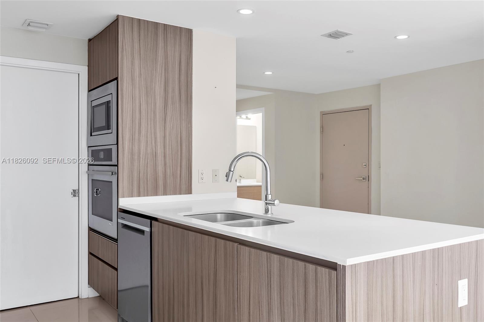 600 Northeast 27th Street, Unit 1105 Miami, FL 33137 - Photo 68 of 100 a close view of a sink and a refrigerator