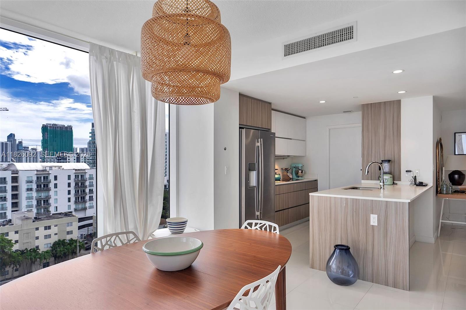 600 Northeast 27th Street, Unit 1105 Miami, FL 33137 - Photo 7 of 100 a living room with furniture and a potted plant