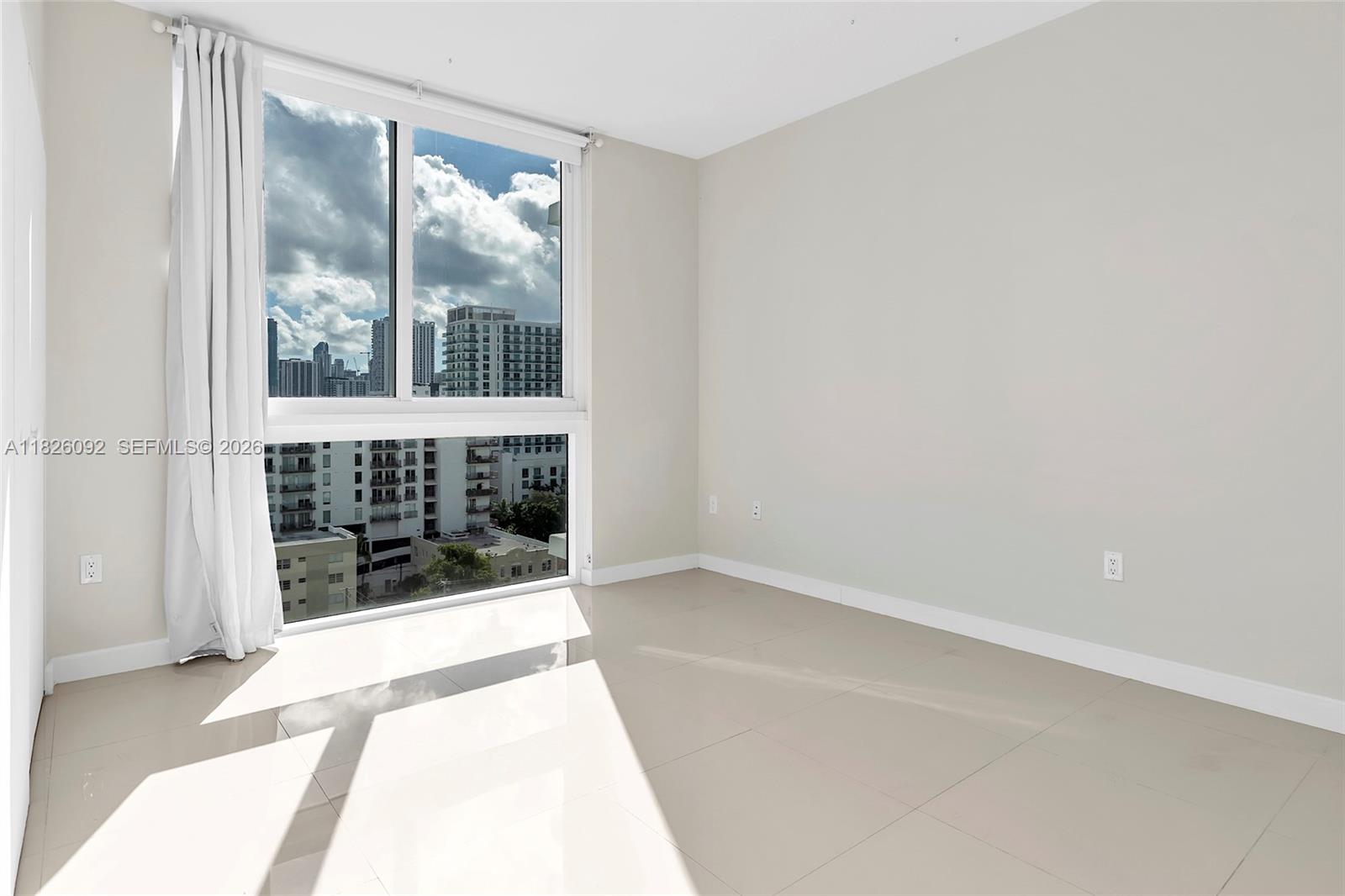 600 Northeast 27th Street, Unit 1105 Miami, FL 33137 - Photo 85 of 100 a view of an empty room with a window