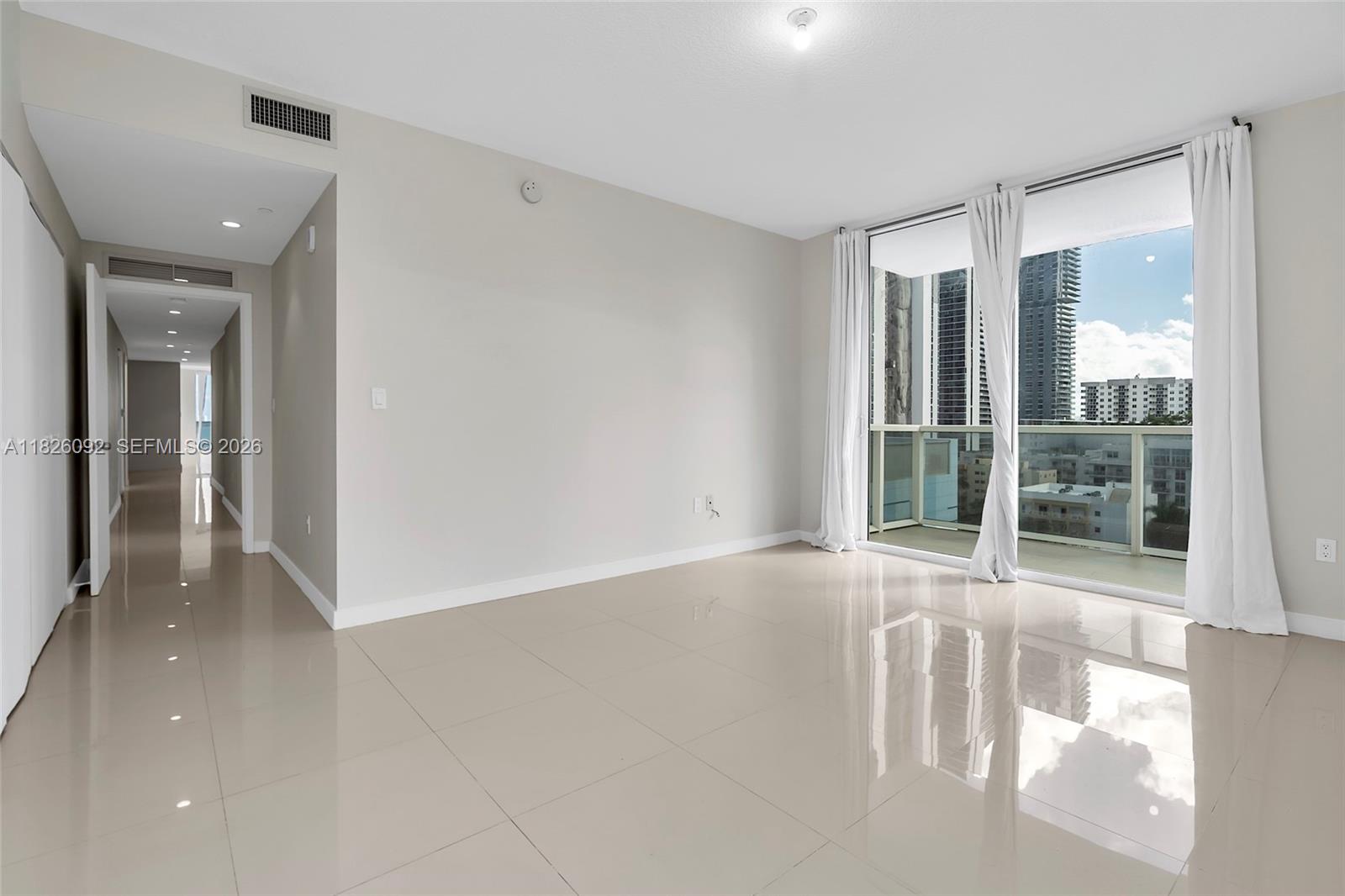600 Northeast 27th Street, Unit 1105 Miami, FL 33137 - Photo 90 of 100 a view of an empty room with glass door