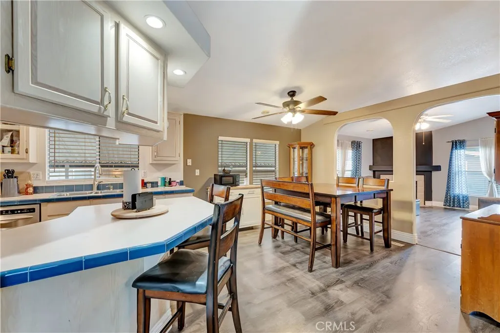 1051 Site, Unit 26 Brea, CA 92821 - Photo 11 of 46 a dining room with furniture and wooden floor