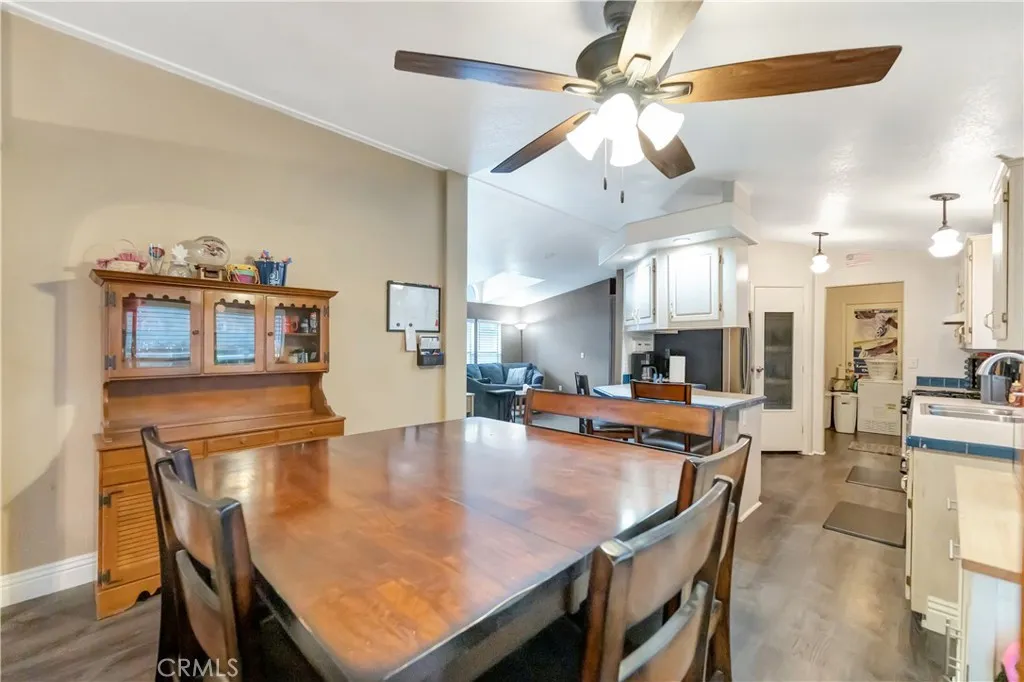 1051 Site, Unit 26 Brea, CA 92821 - Photo 13 of 46 a dining room with furniture and wooden floor