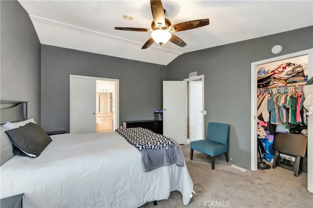 1051 Site, Unit 26 Brea, CA 92821 - Photo 29 of 46 a bedroom with a bed and a chandelier